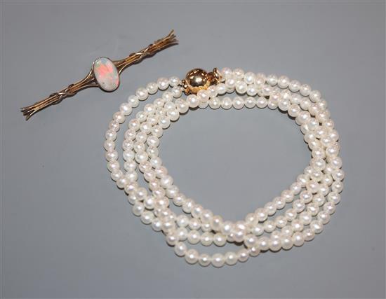A 15ct and opal bar brooch and a two-row uniform pearl necklace with 14k ball clasp.